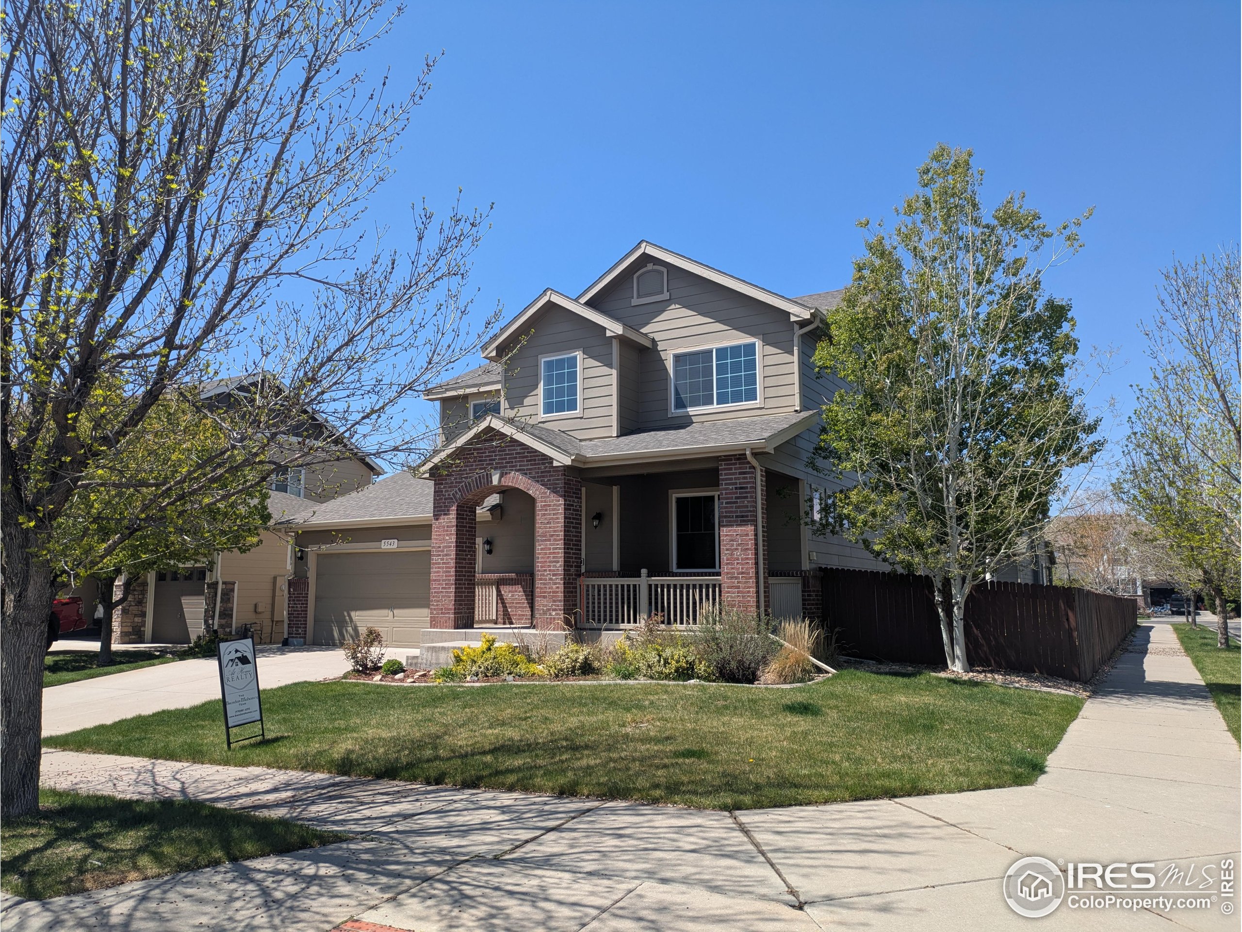 5543 Calgary Street Timnath, CO 80547 - Photo 1 of 38 a front view of a house with garden