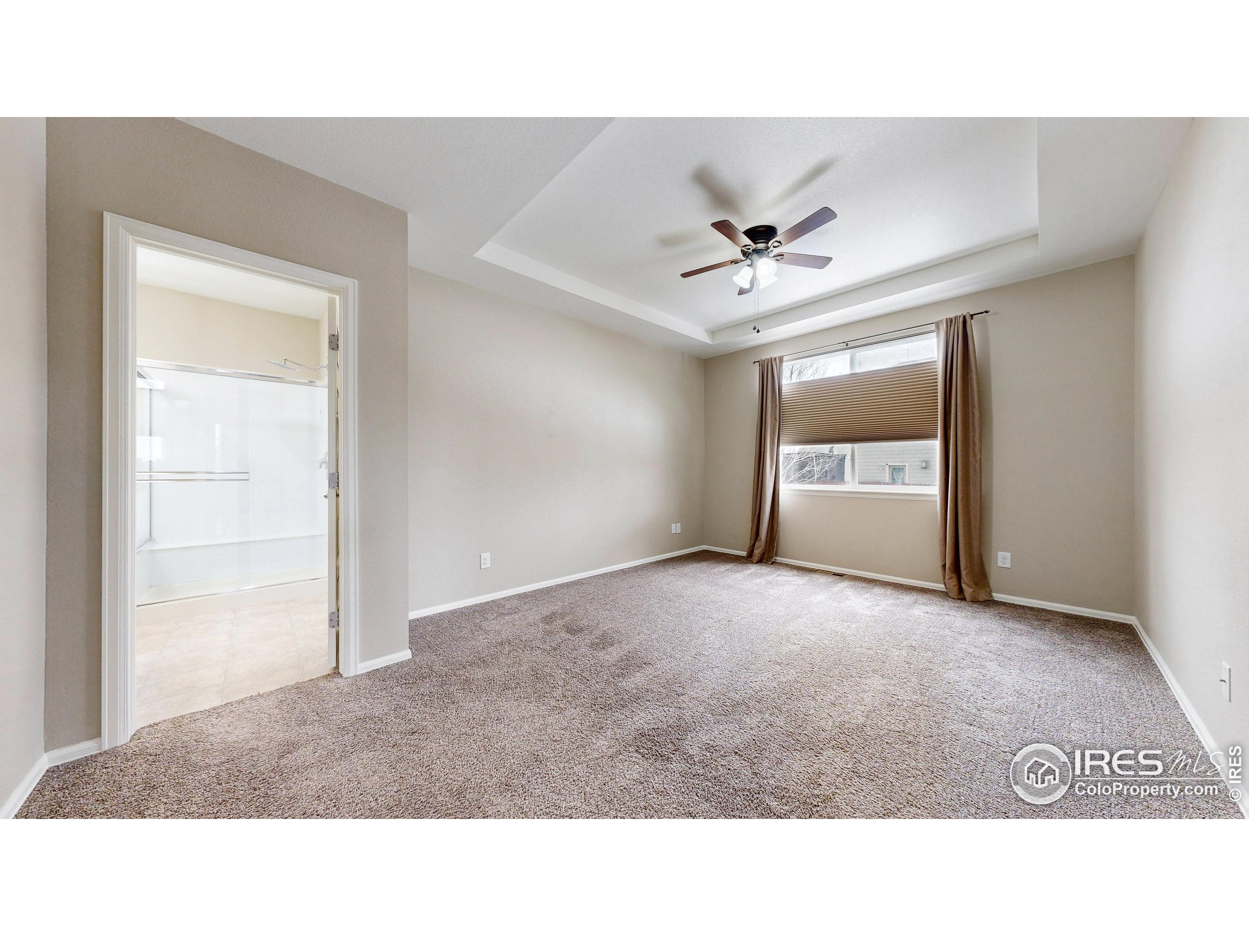 5543 Calgary Street Timnath, CO 80547 - Photo 17 of 38 a open hall with a ceiling fan