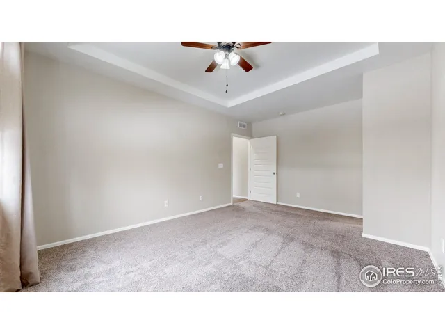 a picture of a bench in front of a wall