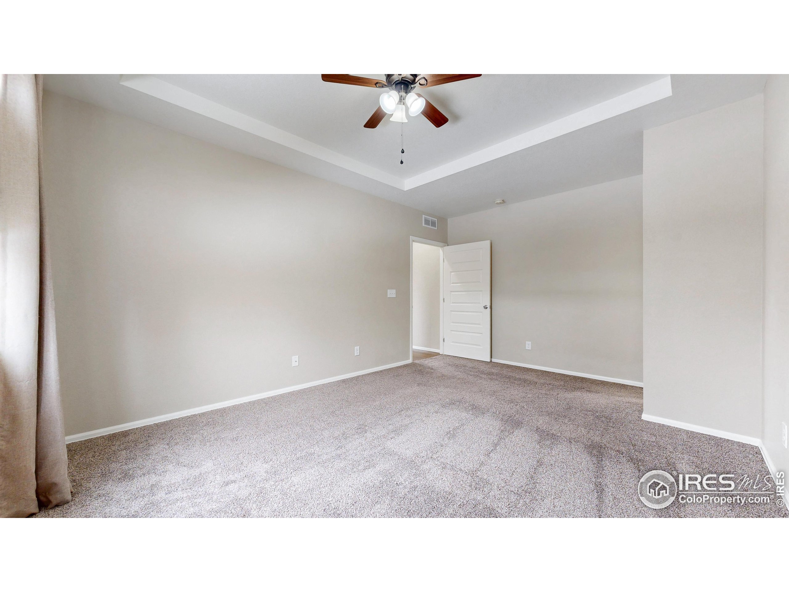 5543 Calgary Street Timnath, CO 80547 - Photo 18 of 38 a open hall with a ceiling fan