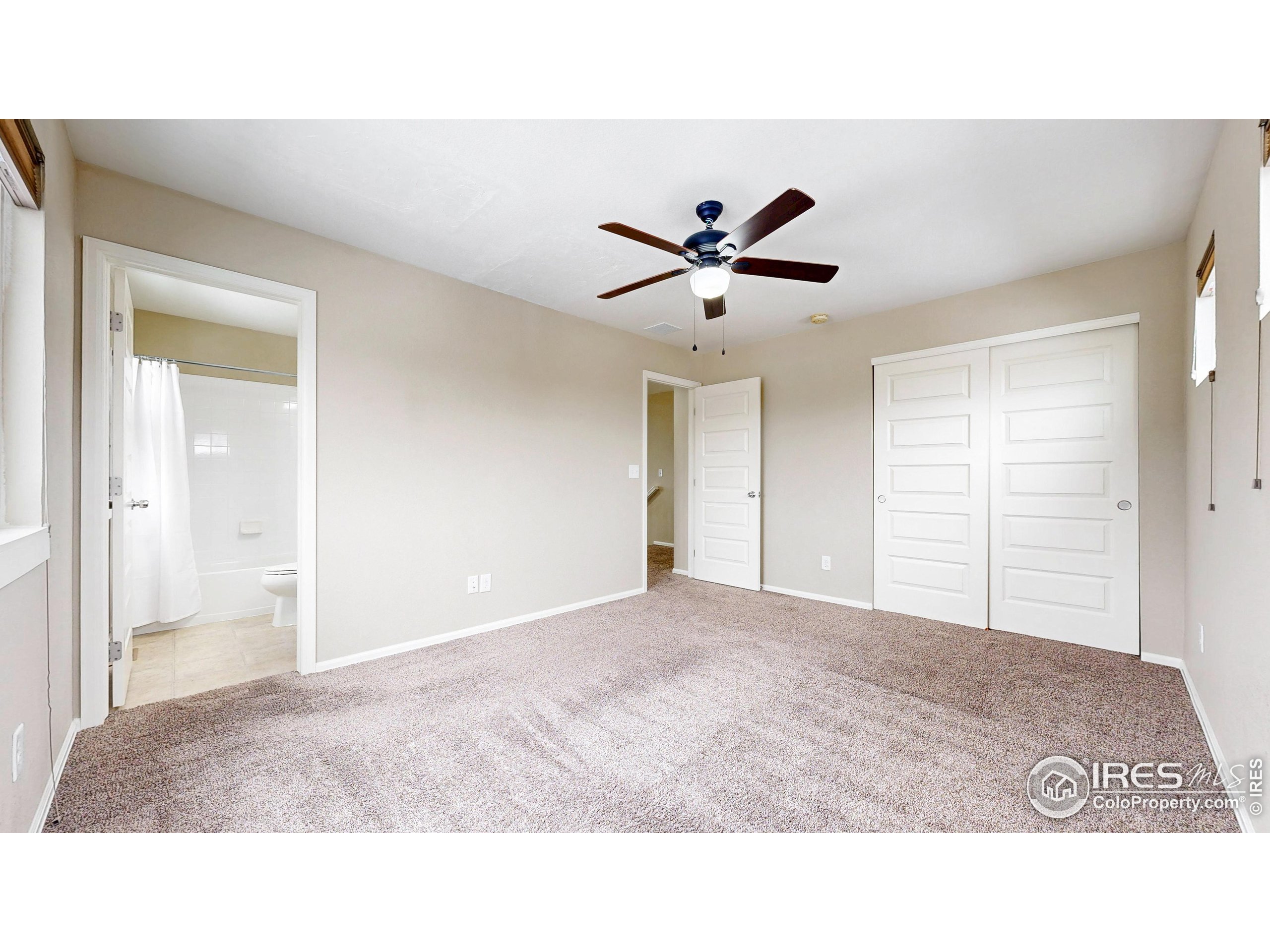 5543 Calgary Street Timnath, CO 80547 - Photo 20 of 38 a living room with a ceiling fan