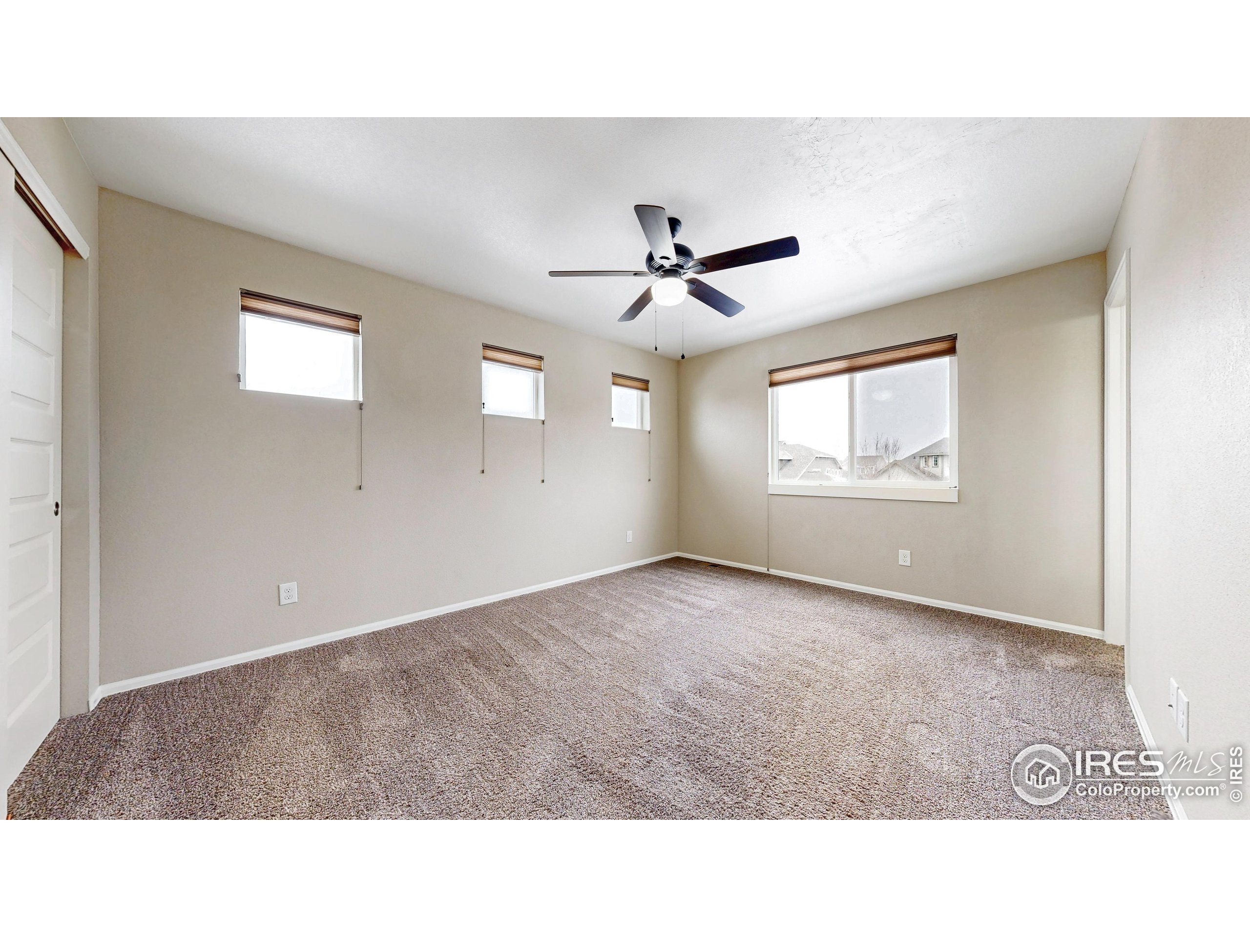 5543 Calgary Street Timnath, CO 80547 - Photo 21 of 38 a black and white photo of a living room