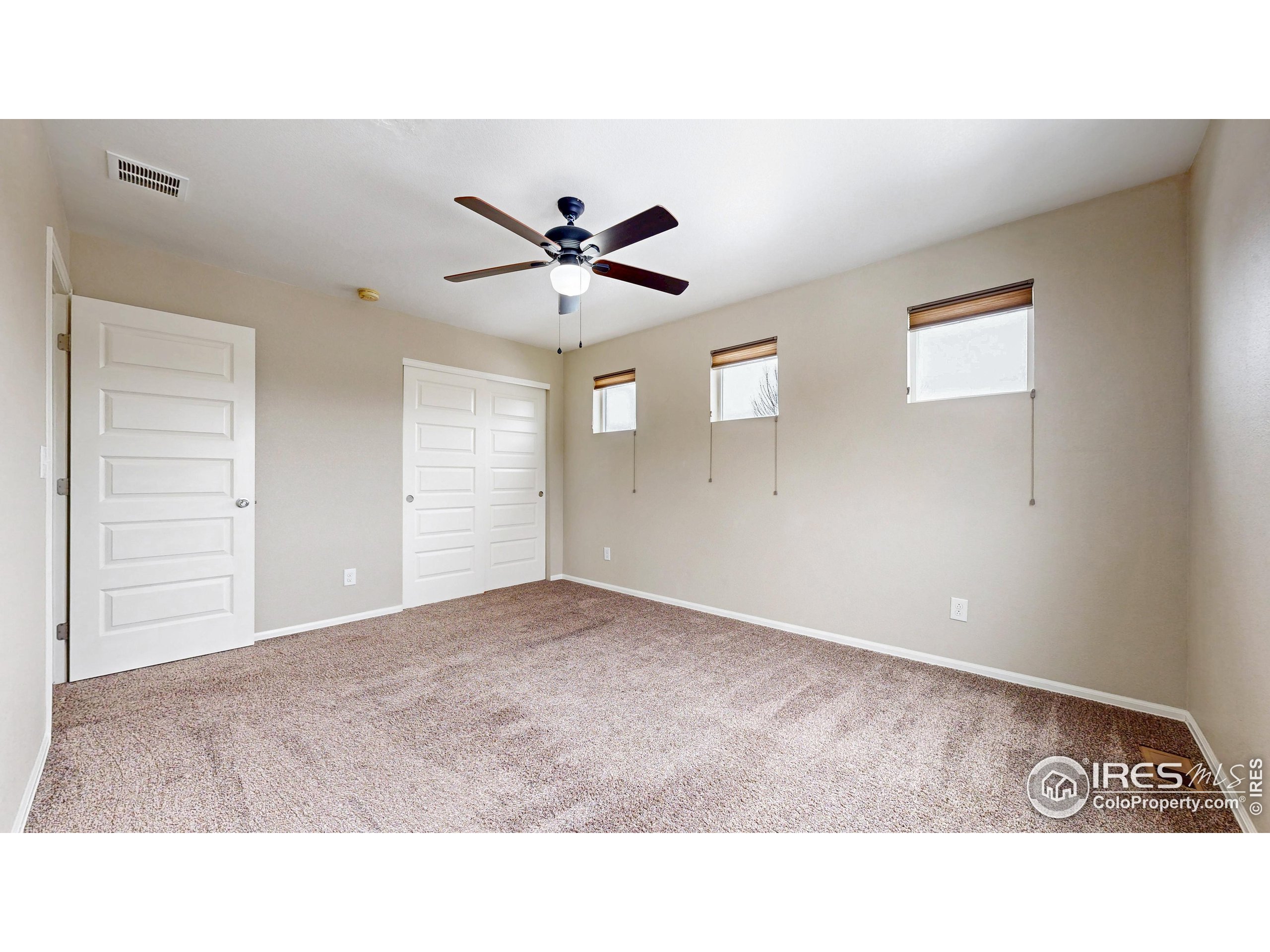 5543 Calgary Street Timnath, CO 80547 - Photo 31 of 38 a open hall with a ceiling fan a window and a ceiling fan