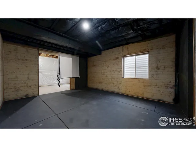 a picture of a bench in front of a wall