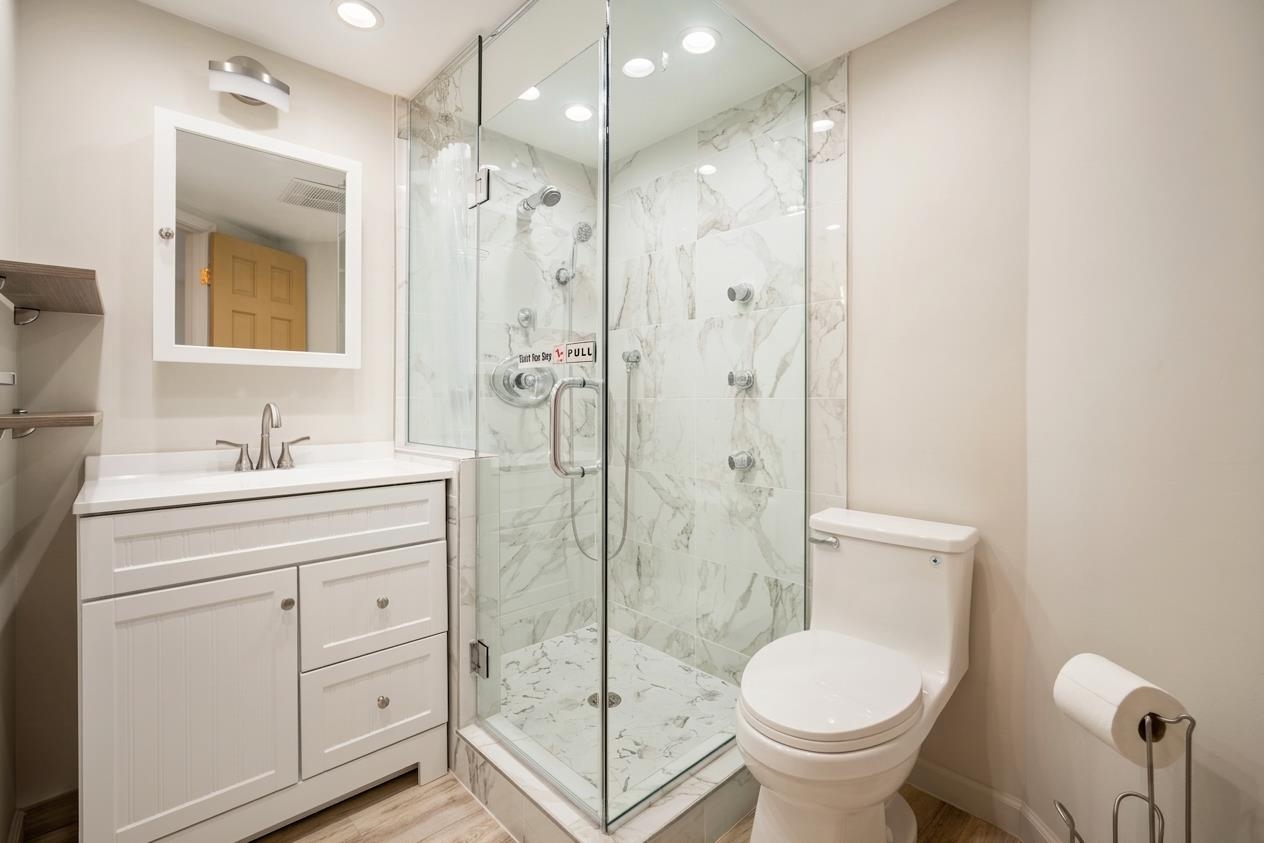 1002 South Kihei Road, Unit 114 Kihei, HI 96753 - Photo 16 of 50 a bathroom with a sink toilet and shower