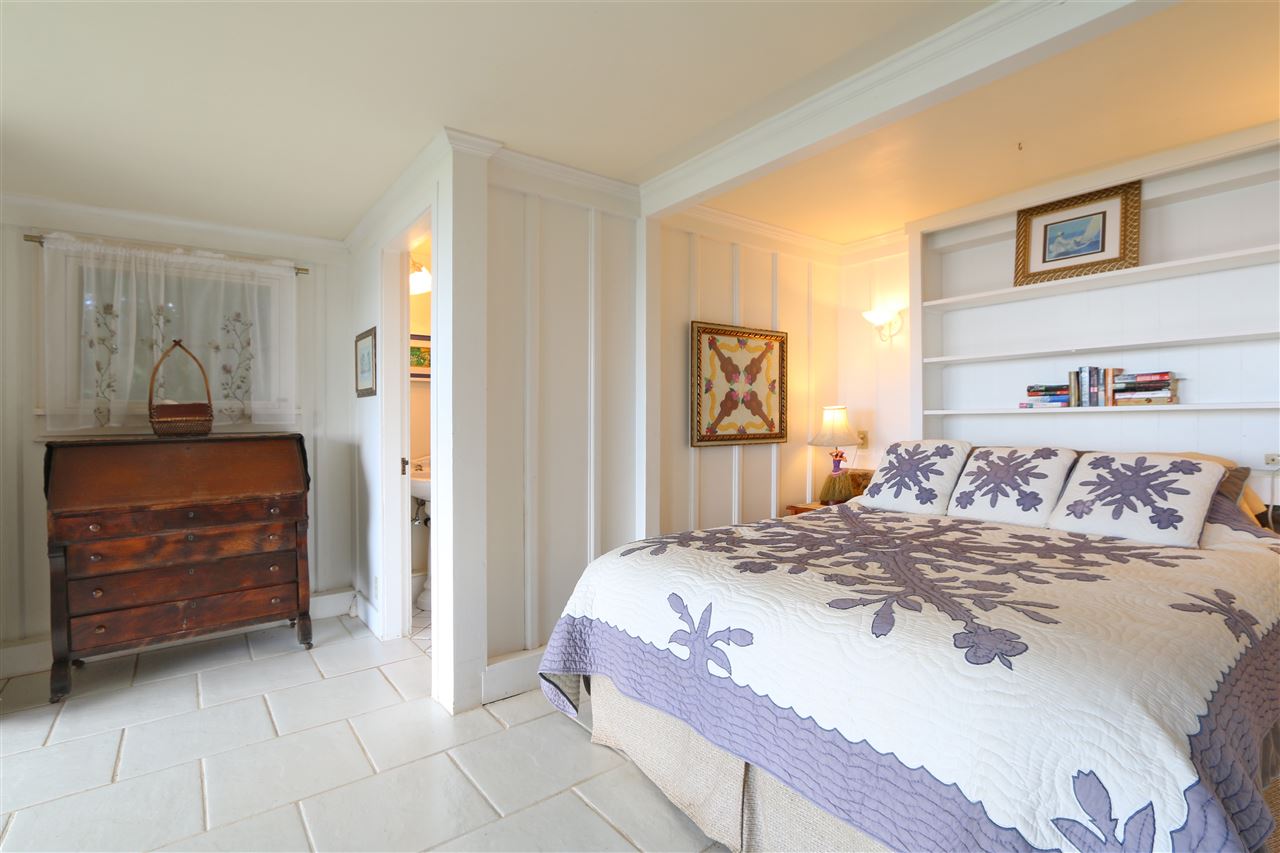 5231 Lower Kula Road Kula, HI 96790 - Photo 15 of 29 a bedroom with a bed and a dresser