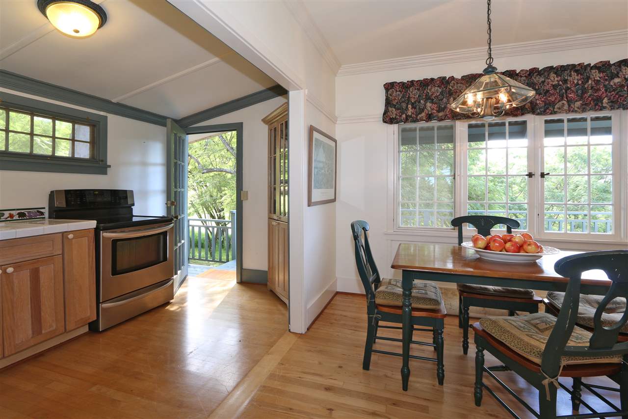 5231 Lower Kula Road Kula, HI 96790 - Photo 9 of 29 a dining room with furniture a chandelier and wooden floor