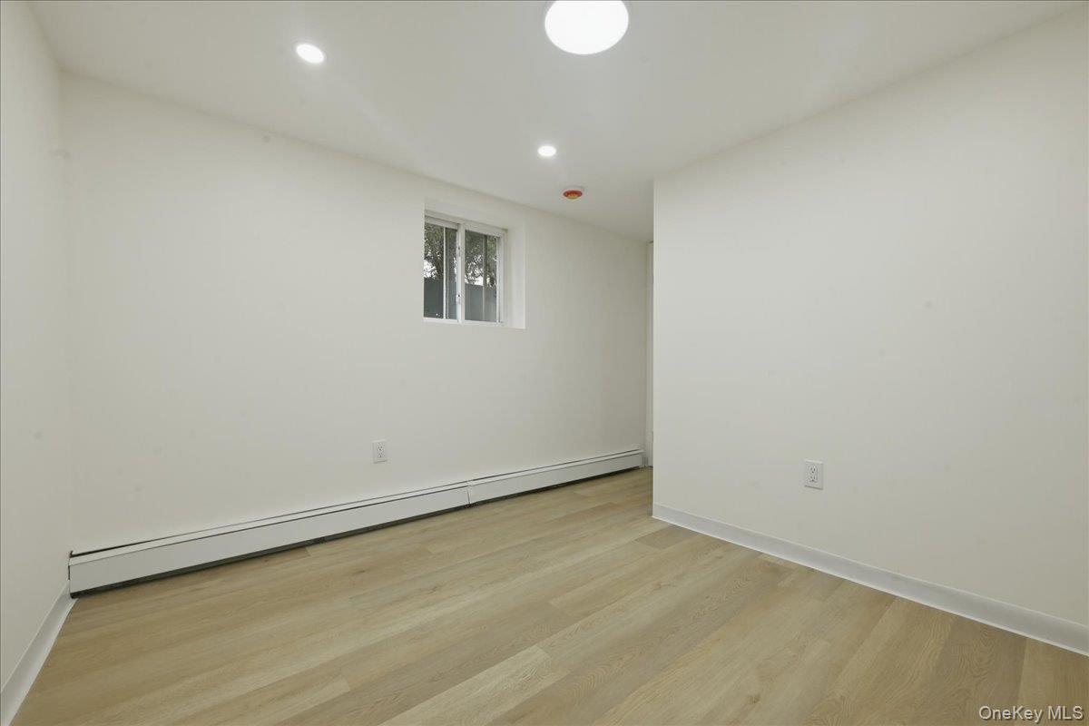 84 North Fordham Road Hicksville, NY 11801 - Photo 25 of 28 wooden floor in an empty room