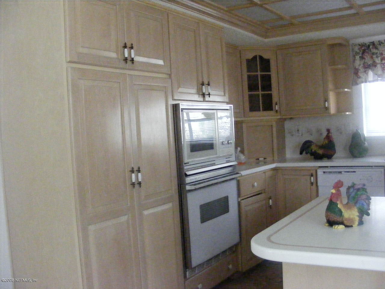 6816 Heidi Road Jacksonville, FL 32277 - Photo 5 of 18 a kitchen with cabinets and stainless steel appliances