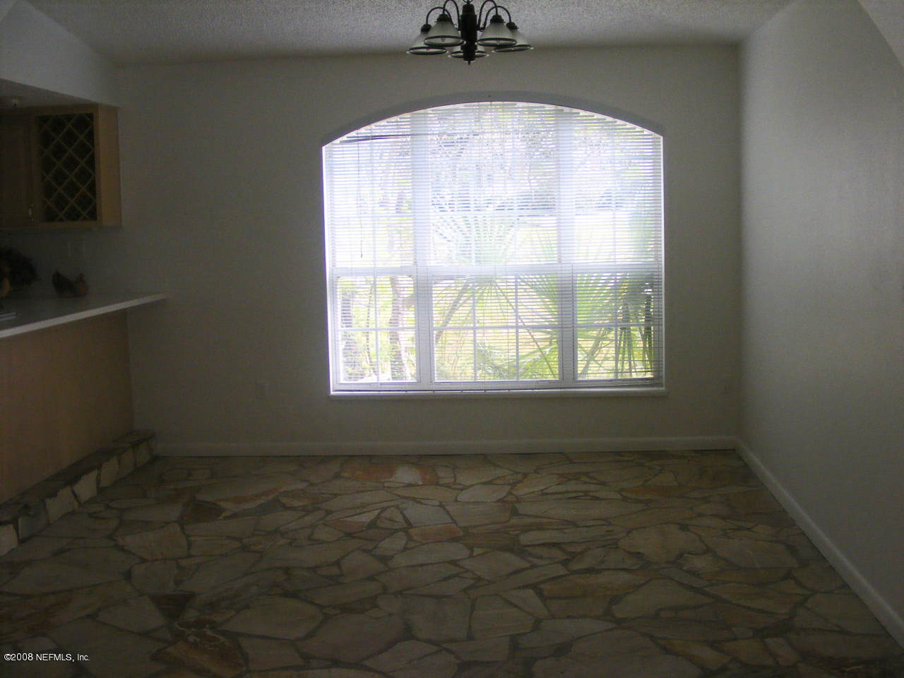 6816 Heidi Road Jacksonville, FL 32277 - Photo 8 of 18 an empty room with a window