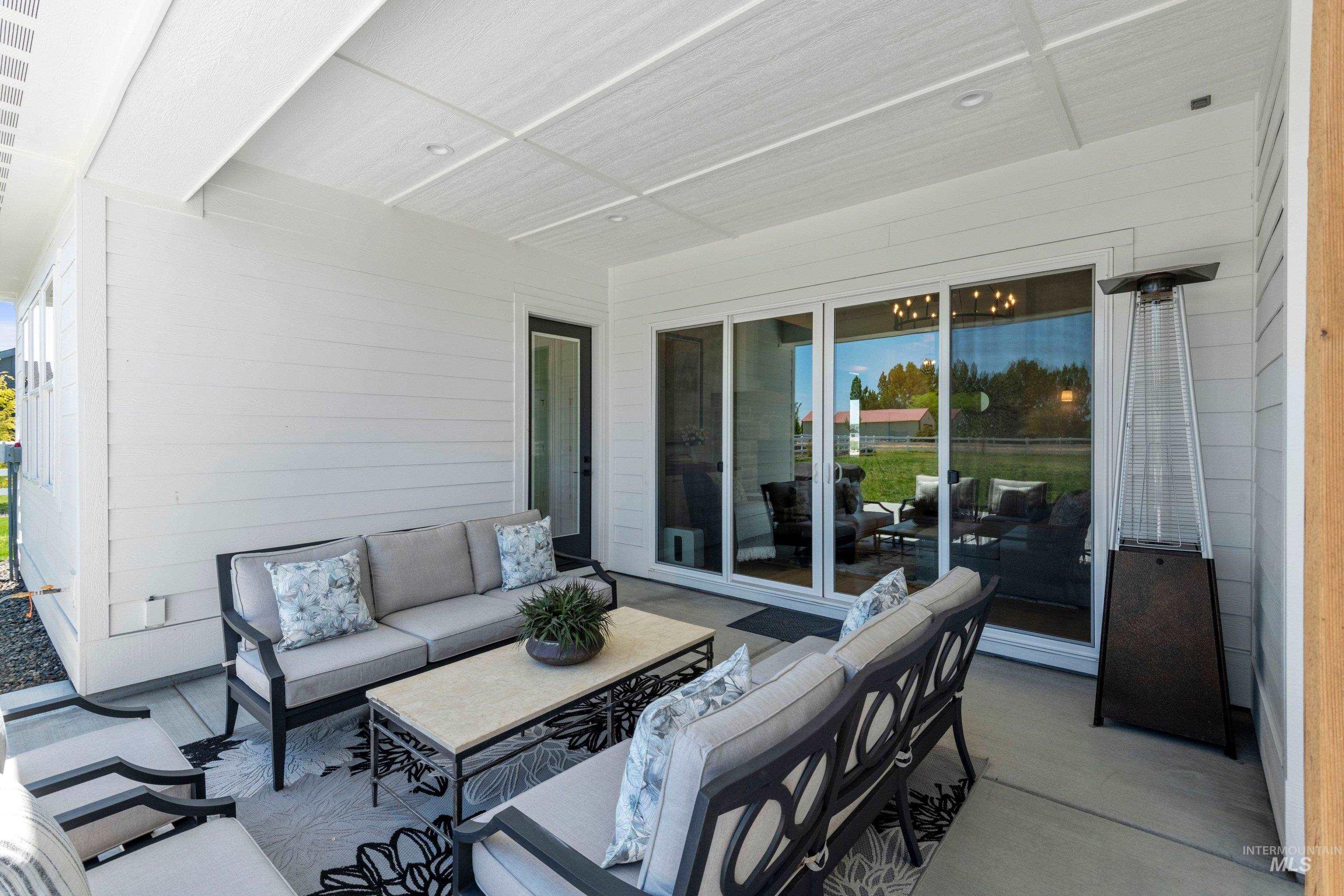 24990 Belgian Way Middleton, ID 83644 - Photo 38 of 50 Covered patio featuring a concrete surface, white horizontal siding, and a white paneled ceiling with recessed lighting