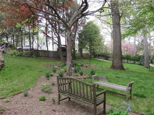 a view of a bench in a garden