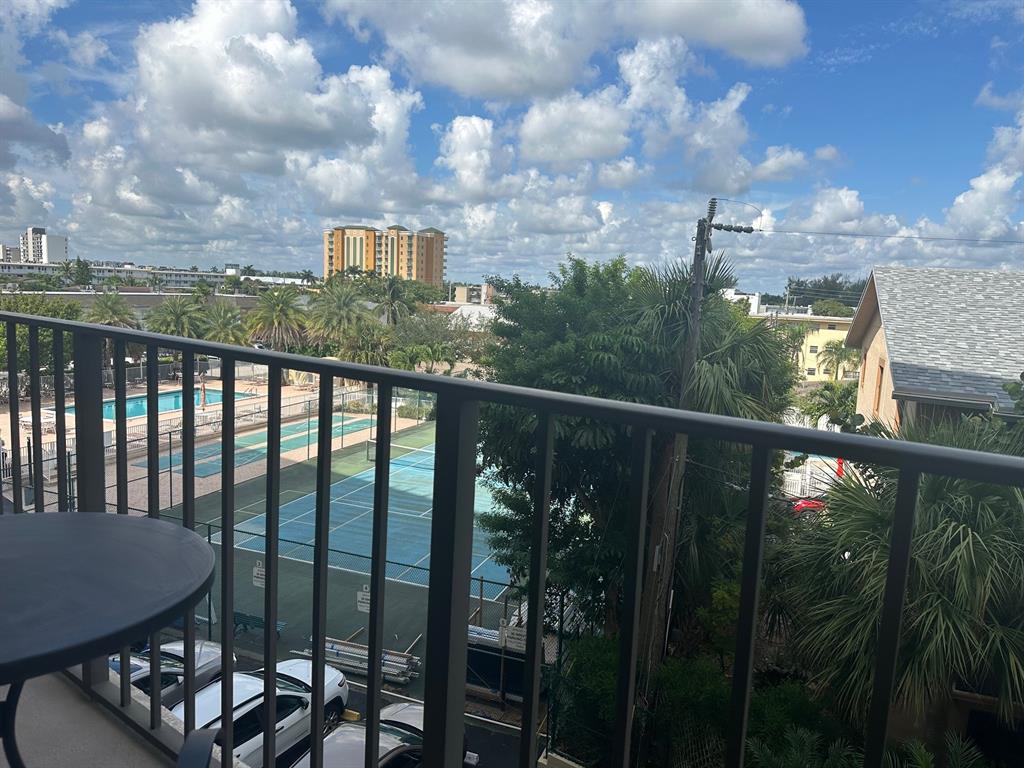 1009 North Ocean Boulevard, Unit 407 Pompano Beach, FL 33062 - Photo 14 of 35 a view of a balcony with an outdoor space
