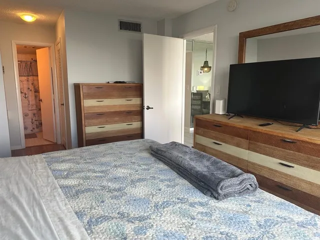 a view of a swimming pool with a chair and tables