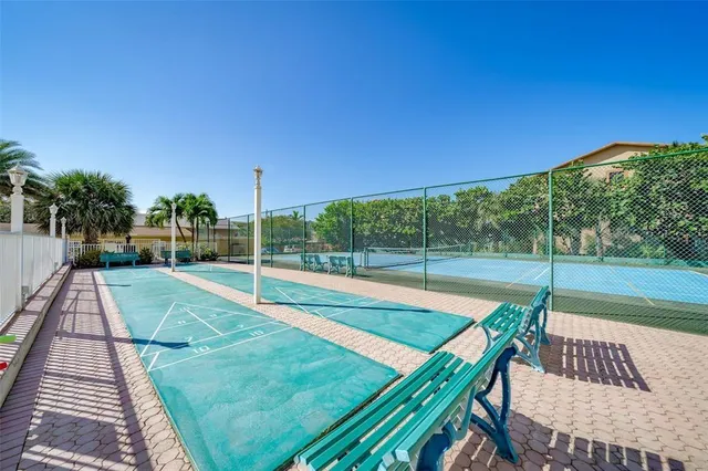 a view of a park with basketball court