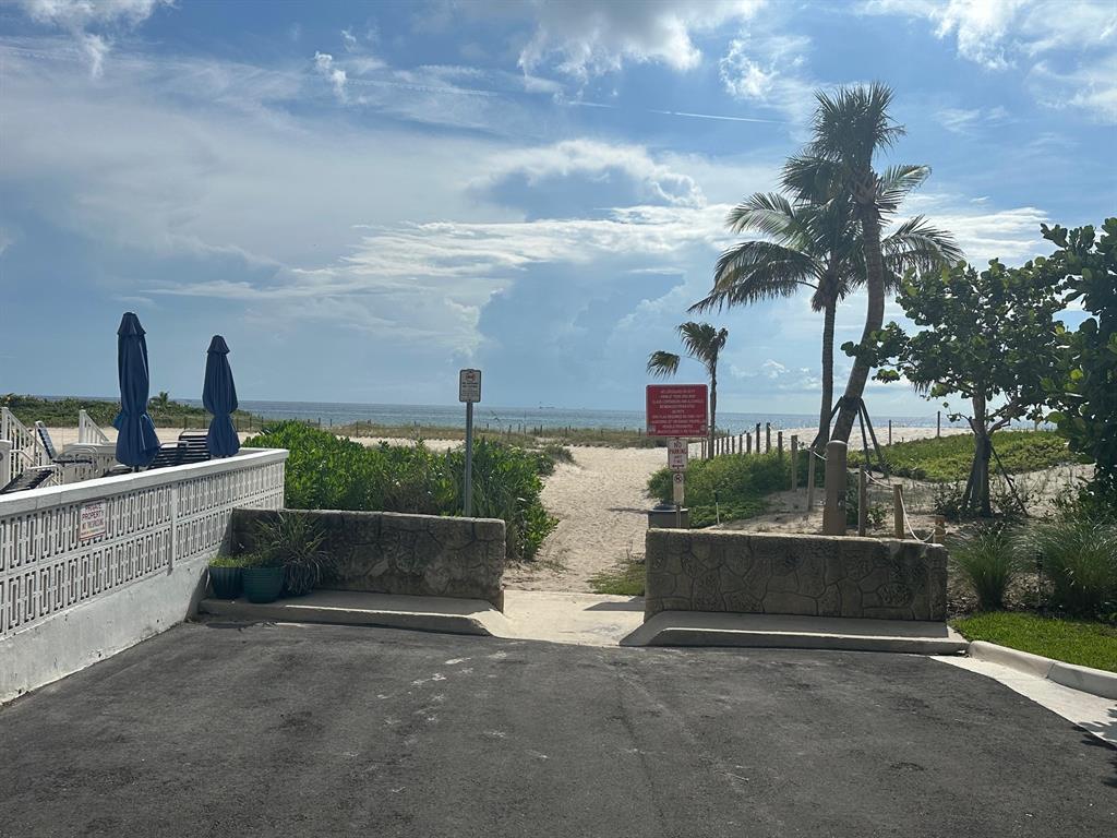 1009 North Ocean Boulevard, Unit 407 Pompano Beach, FL 33062 - Photo 25 of 35 a front view of a house with a garden and mountain view