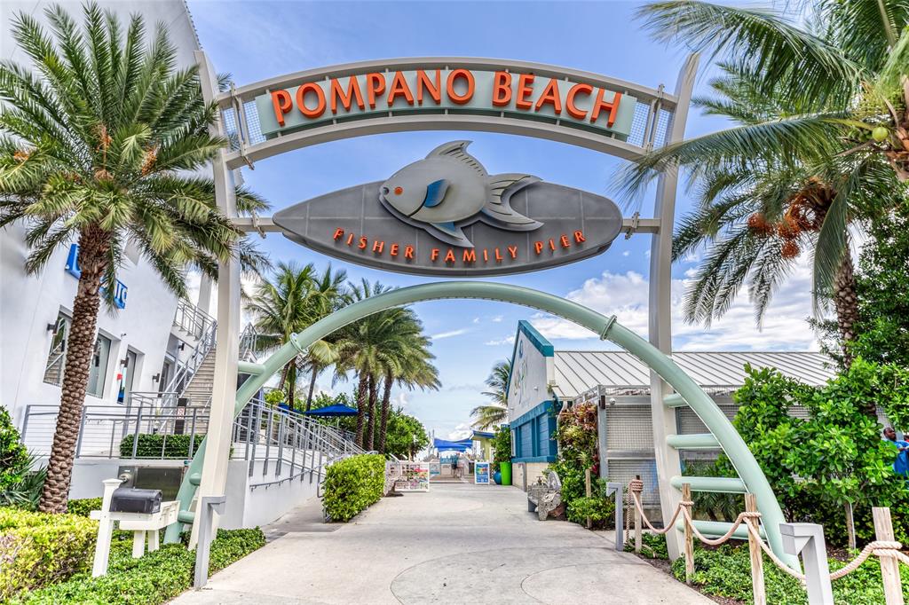 1009 North Ocean Boulevard, Unit 407 Pompano Beach, FL 33062 - Photo 31 of 35 a front view of a house with garden