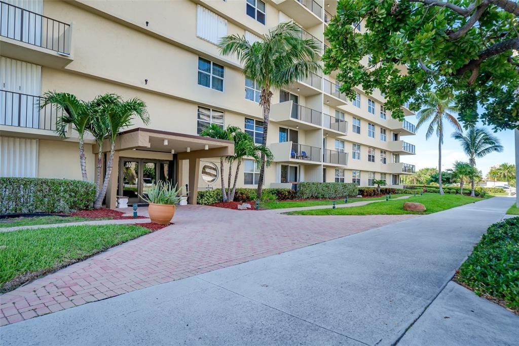 1009 North Ocean Boulevard, Unit 407 Pompano Beach, FL 33062 - Photo 4 of 35 a view of an apartment with a garden