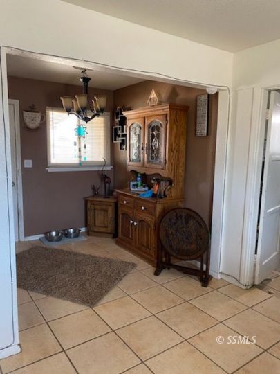 232 North Alvord Street Ridgecrest, CA 93555 - Photo 3 of 11 a living room with furniture and a window