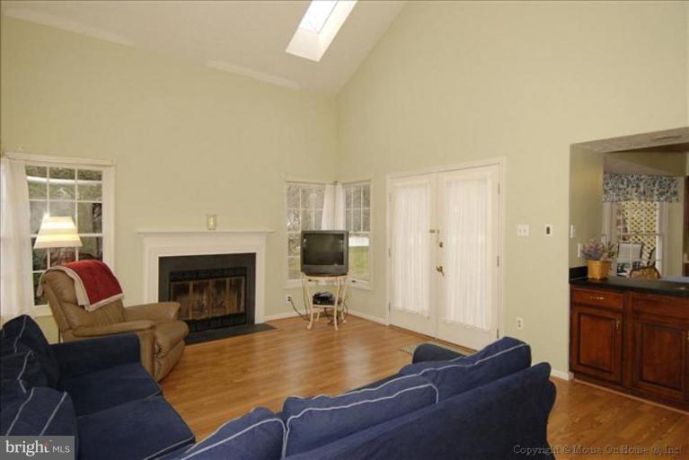 913 Metfield Road Towson, MD 21286 - Photo 14 of 26 a living room with furniture and a fireplace