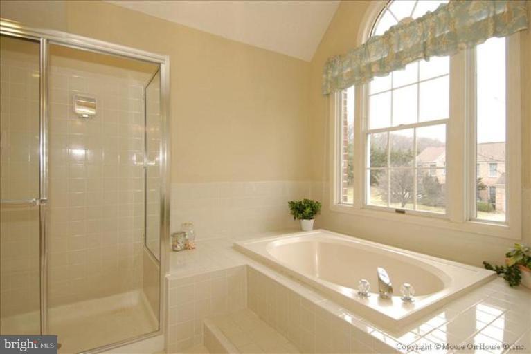 913 Metfield Road Towson, MD 21286 - Photo 8 of 26 a bath tub sitting next to a window