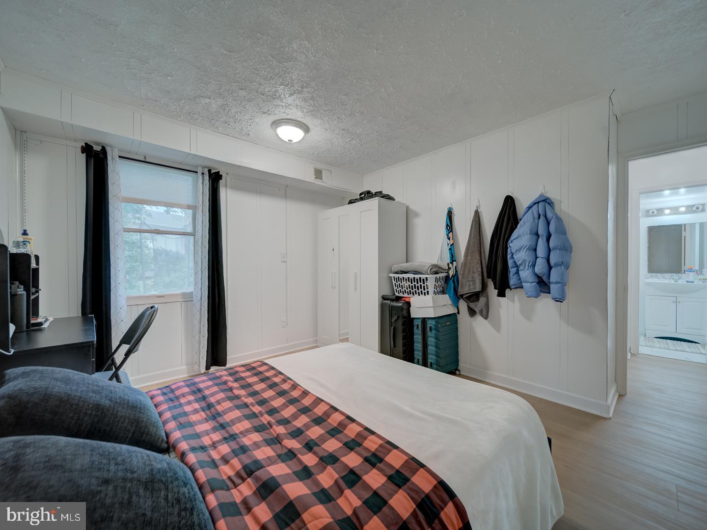 10397 Blue Arrow Court Columbia, MD 21044 - Photo 13 of 43 a bedroom with a bed and a walk in closet