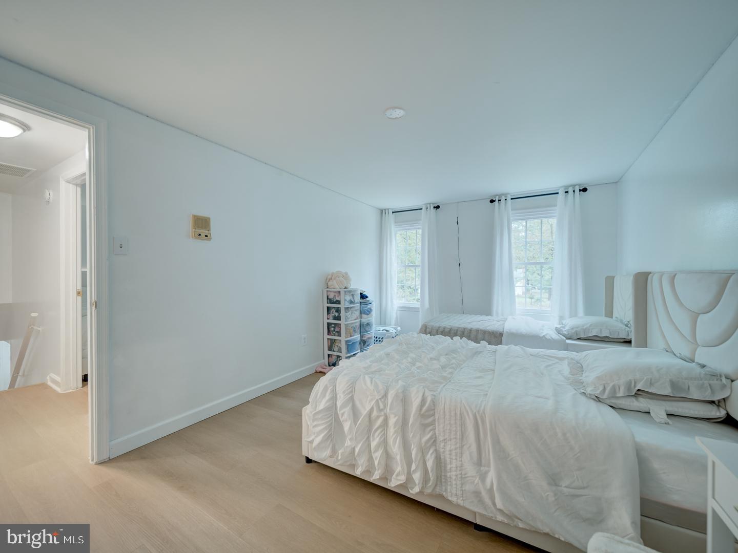 10397 Blue Arrow Court Columbia, MD 21044 - Photo 18 of 43 a bedroom with a bed and a couch