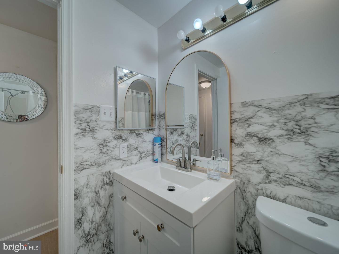 10397 Blue Arrow Court Columbia, MD 21044 - Photo 20 of 43 a bathroom with a sink and a mirror