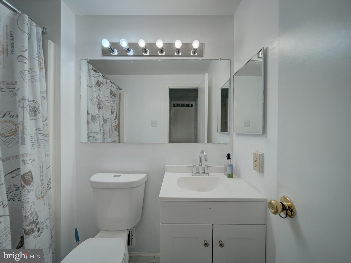 10397 Blue Arrow Court Columbia, MD 21044 - Photo 23 of 43 a bathroom with a sink and mirror with toilet