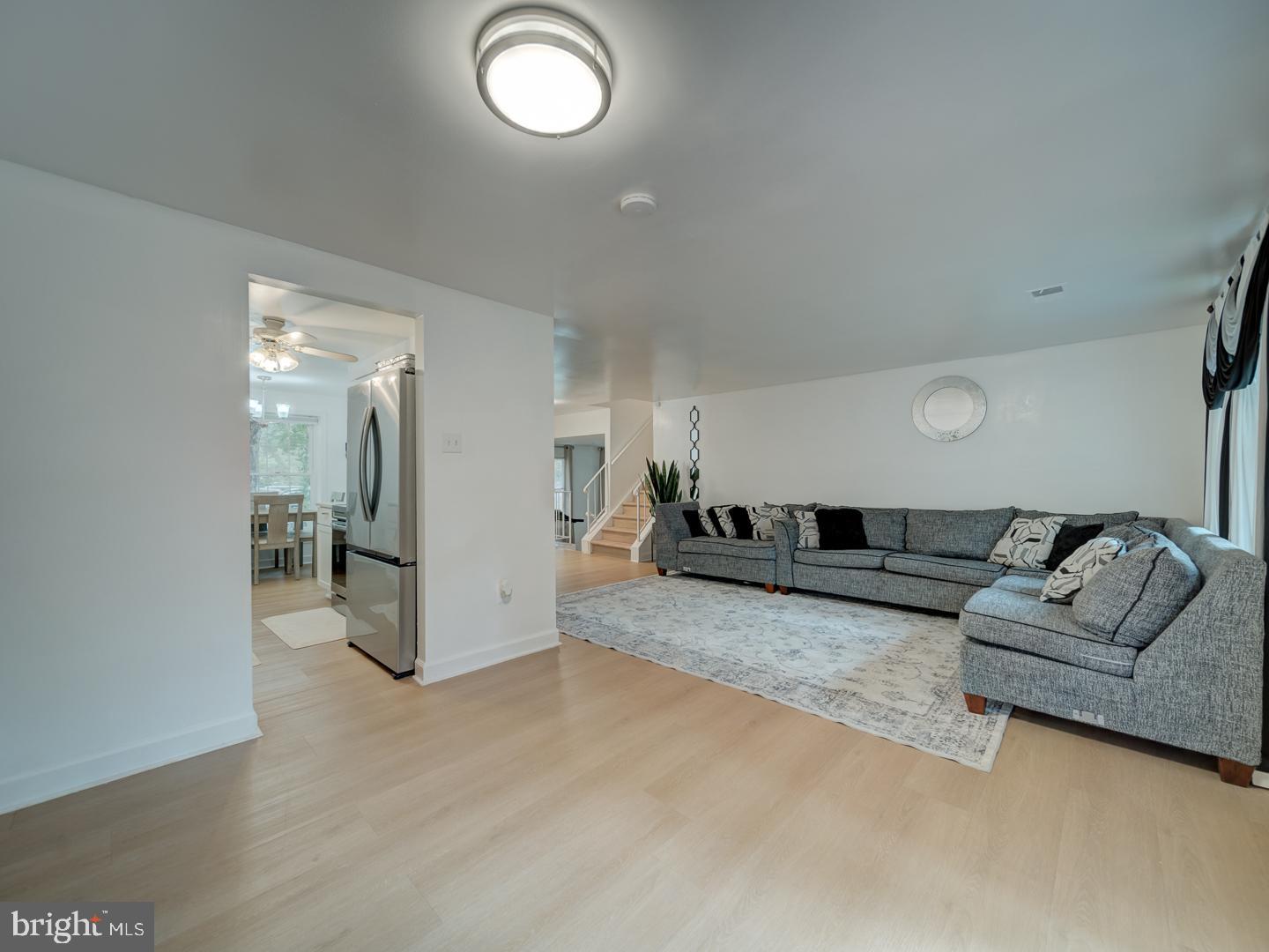 10397 Blue Arrow Court Columbia, MD 21044 - Photo 28 of 43 a living room with furniture and a couch