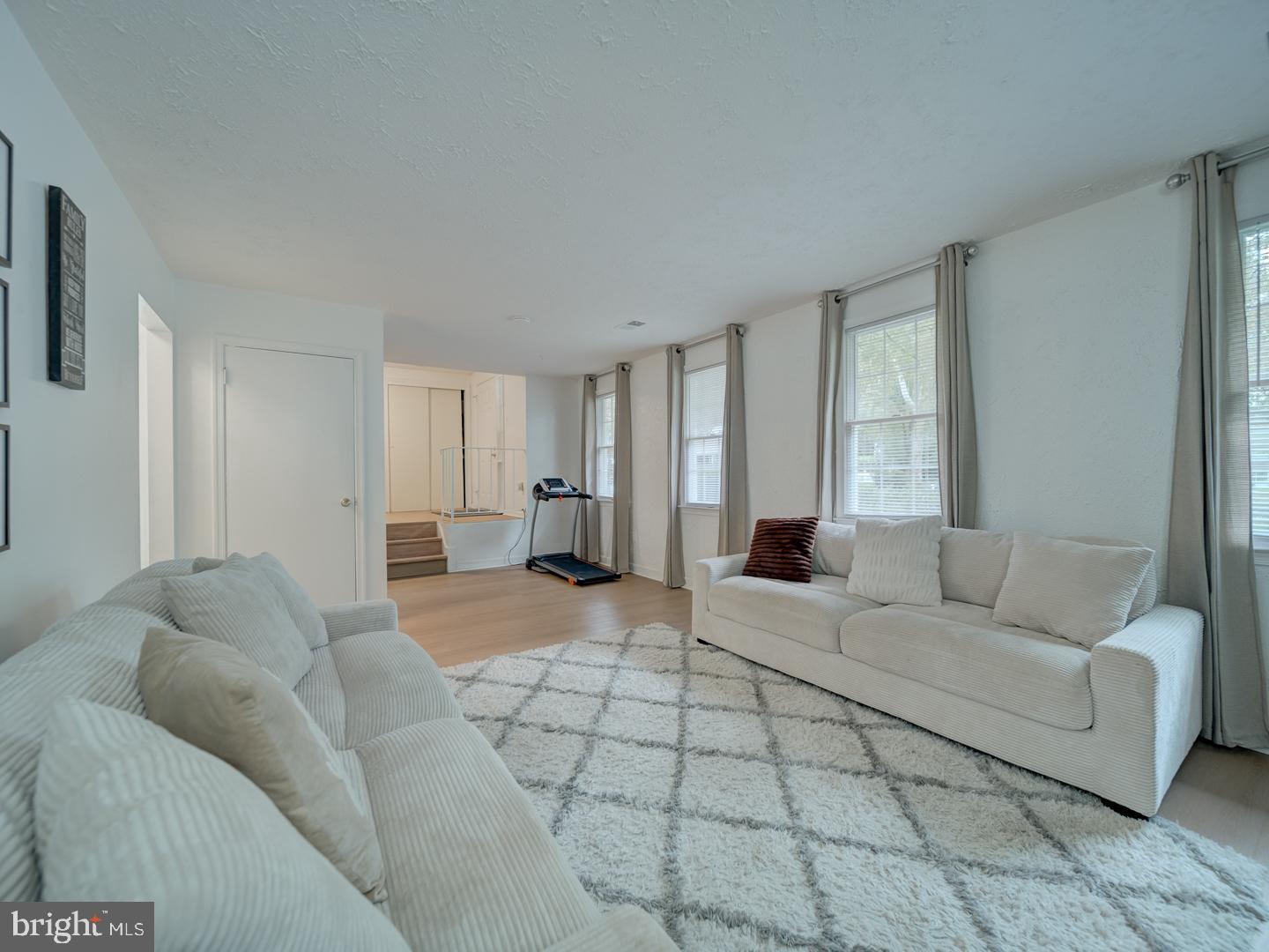 10397 Blue Arrow Court Columbia, MD 21044 - Photo 6 of 43 a bedroom with a bed and a couch