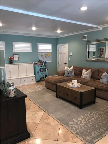 a living room with fireplace furniture and decor