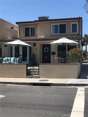 a front view of a house with parking space