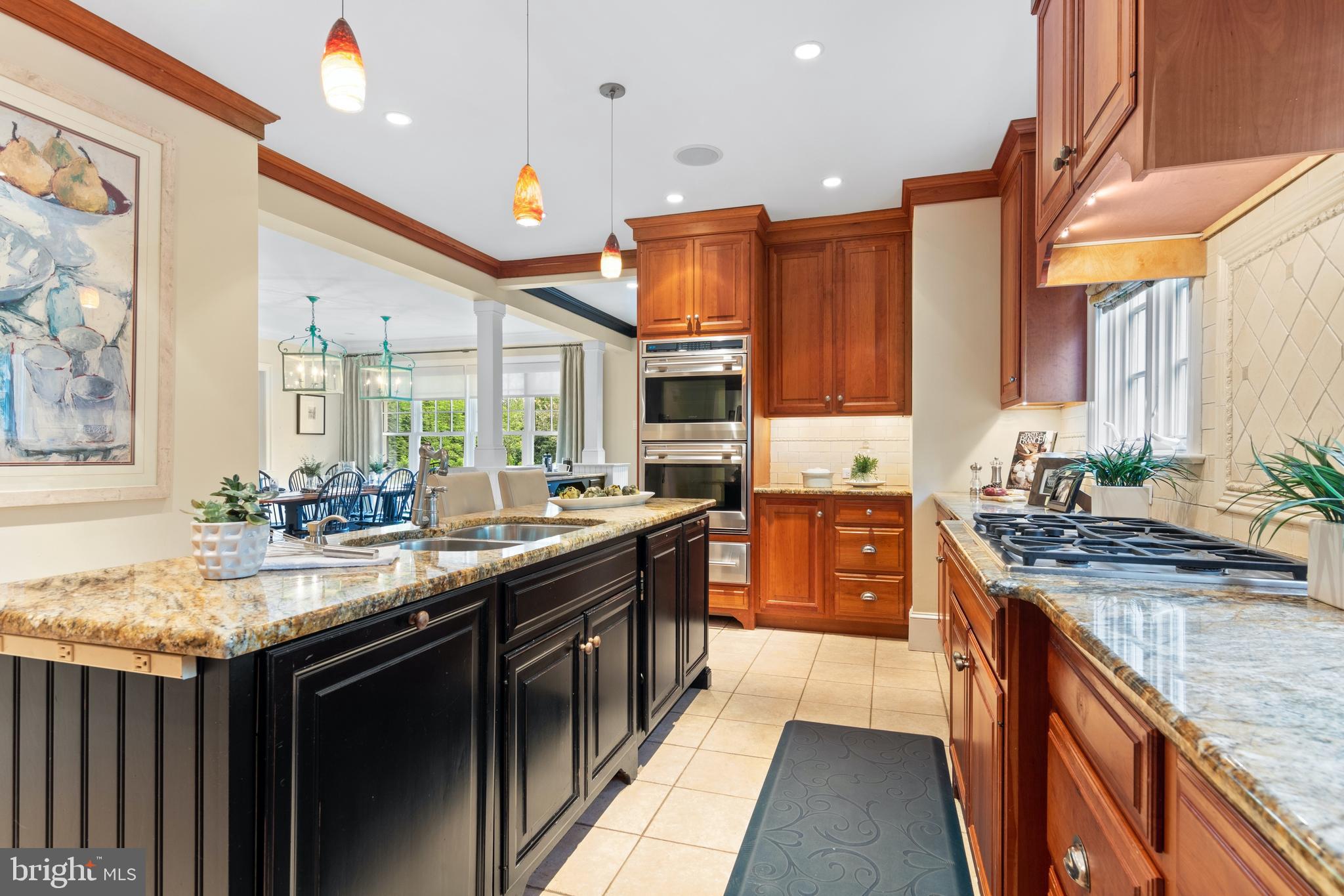 512 Dorset Road Devon, PA 19333 - Photo 26 of 48 a kitchen with granite countertop a sink stove and cabinets