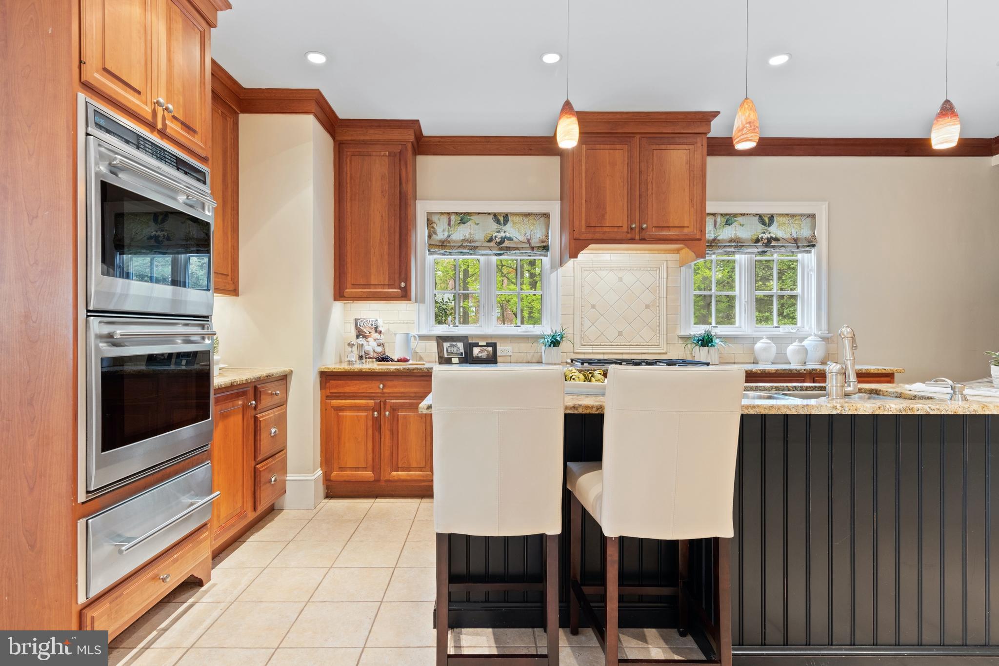 512 Dorset Road Devon, PA 19333 - Photo 27 of 48 a kitchen with a stove a sink and a refrigerator