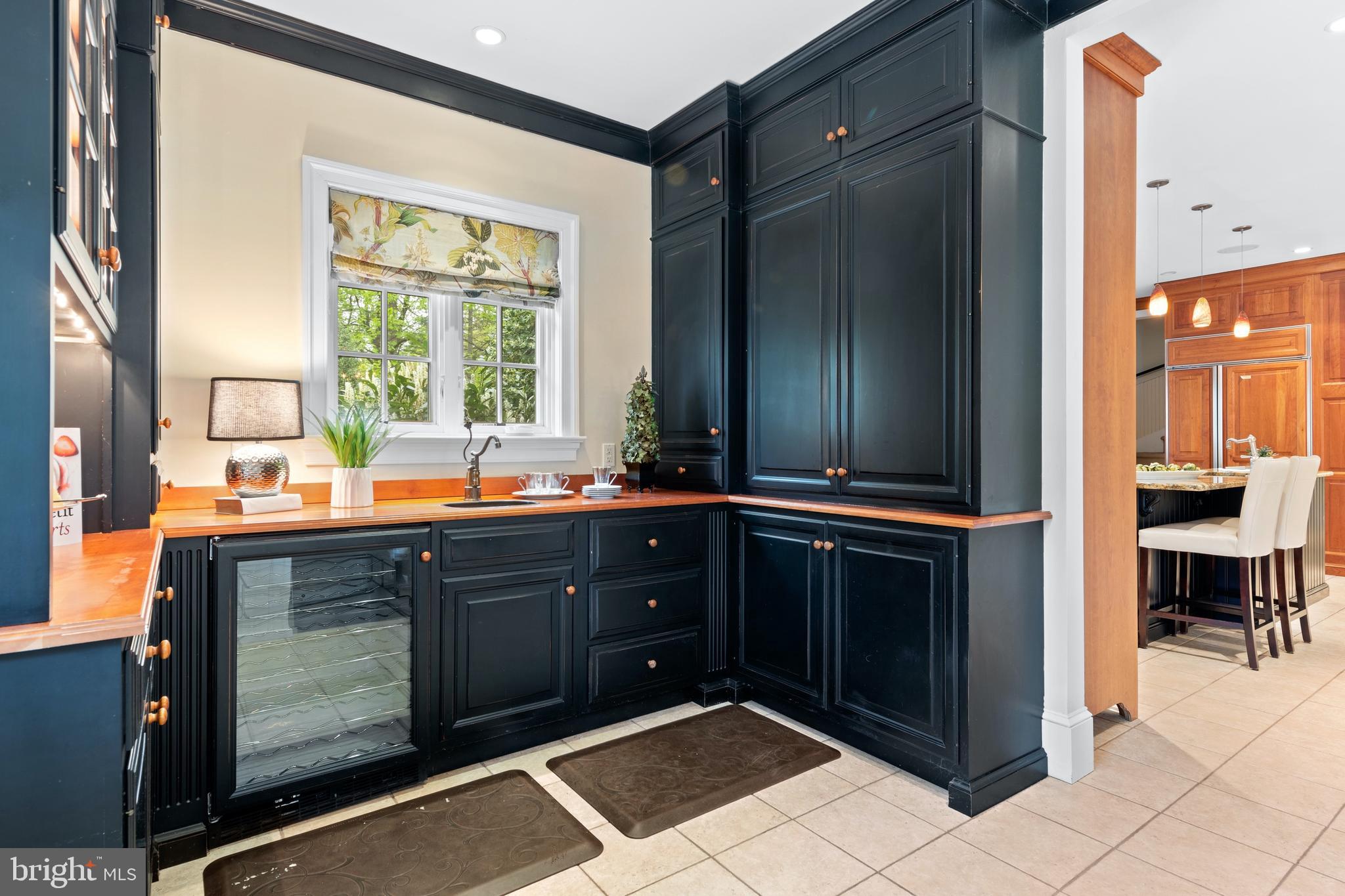 512 Dorset Road Devon, PA 19333 - Photo 29 of 48 a bathroom with a sink and a large mirror