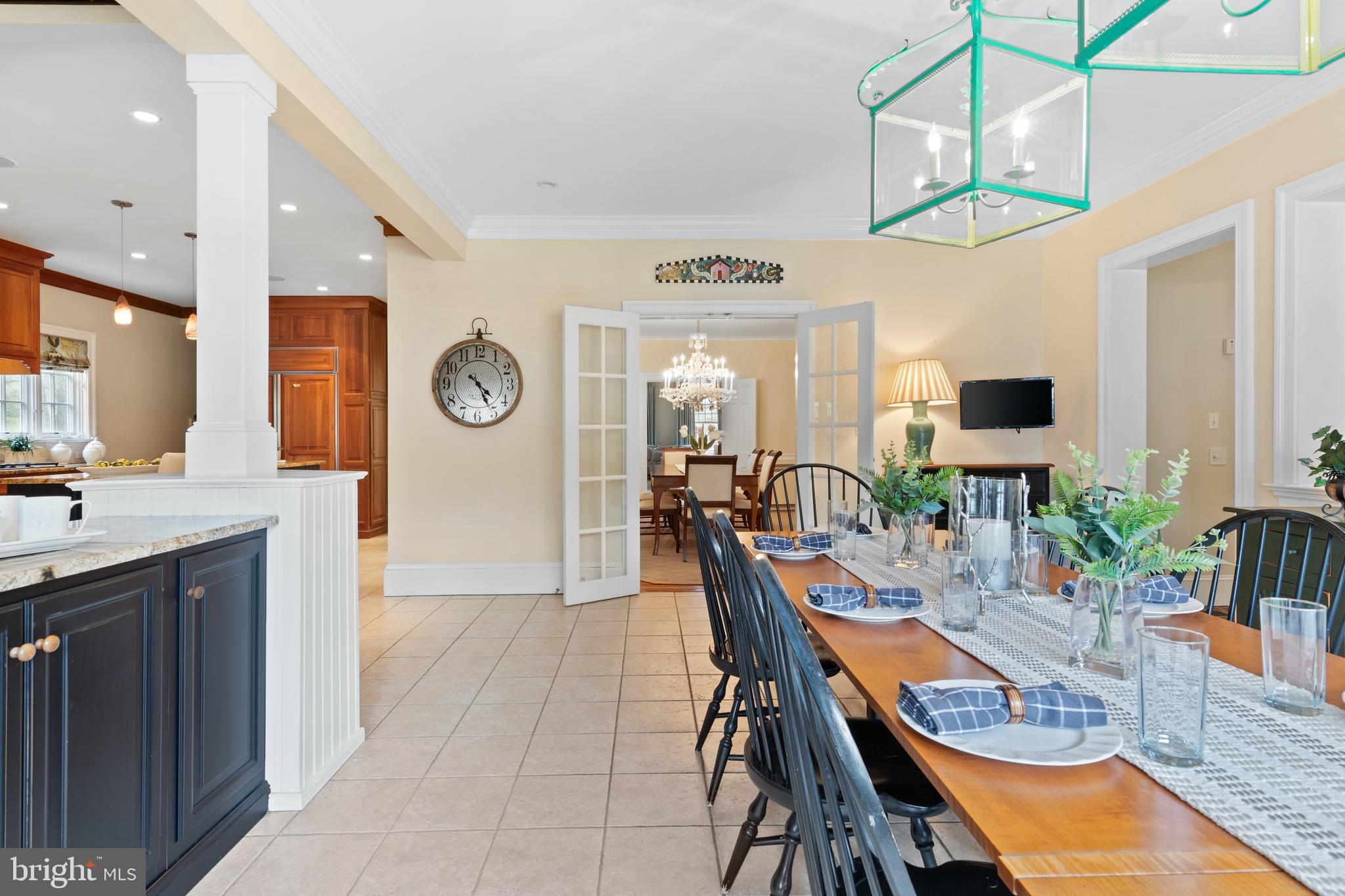 512 Dorset Road Devon, PA 19333 - Photo 33 of 48 a dining room with stainless steel appliances kitchen island granite countertop a table chairs and a sink