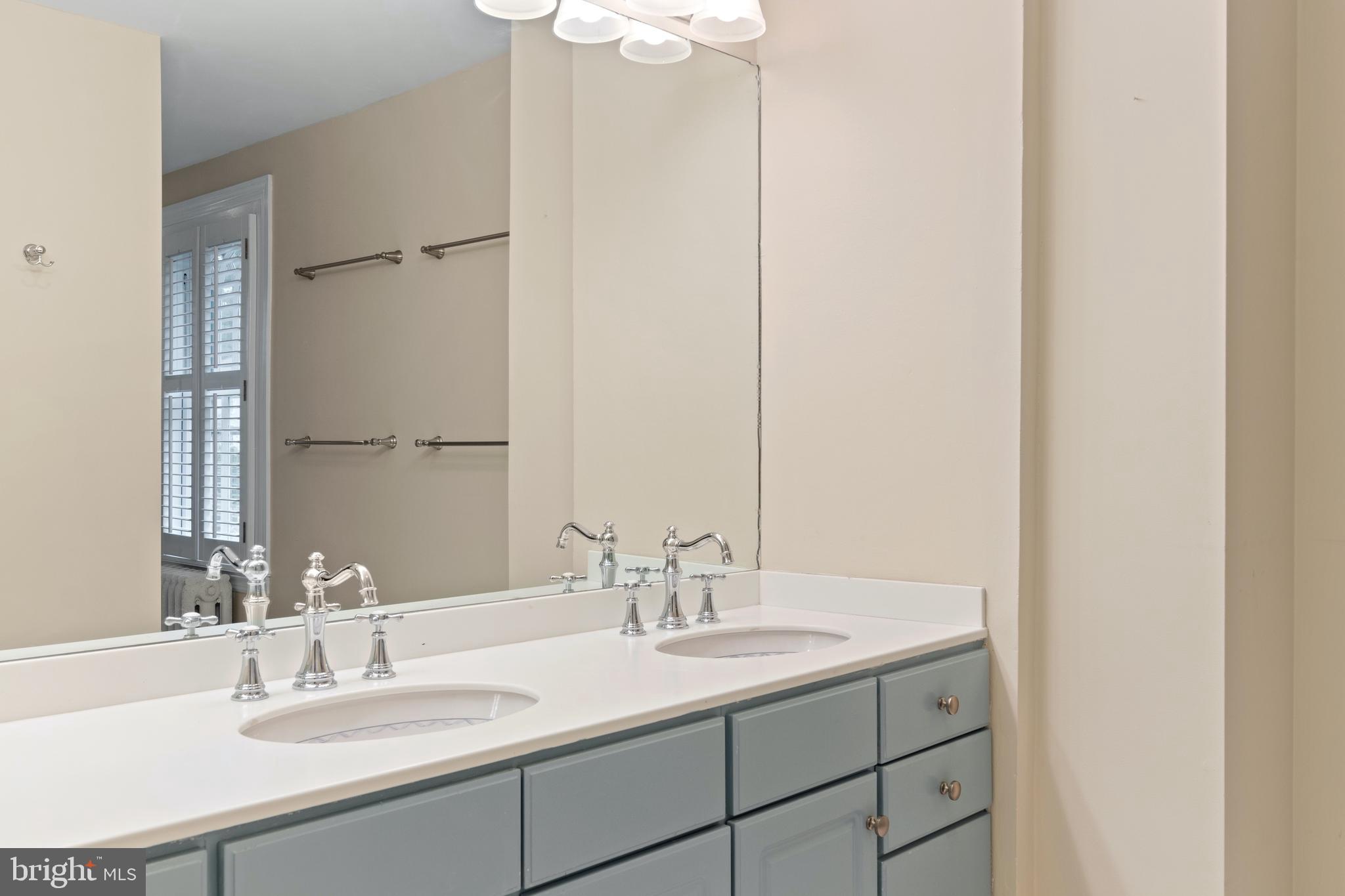 512 Dorset Road Devon, PA 19333 - Photo 39 of 48 a bathroom with a sink and a mirror