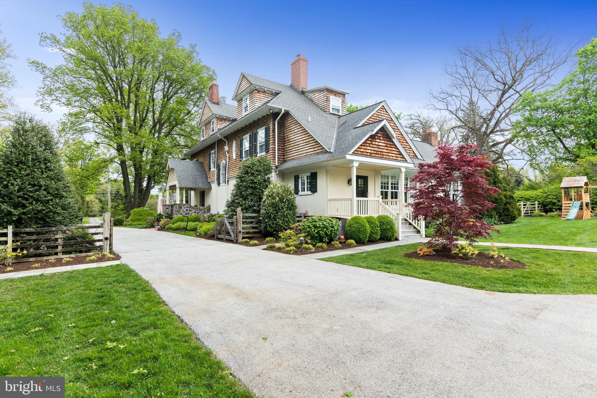 512 Dorset Road Devon, PA 19333 - Photo 5 of 48 a front view of house with yard and green space