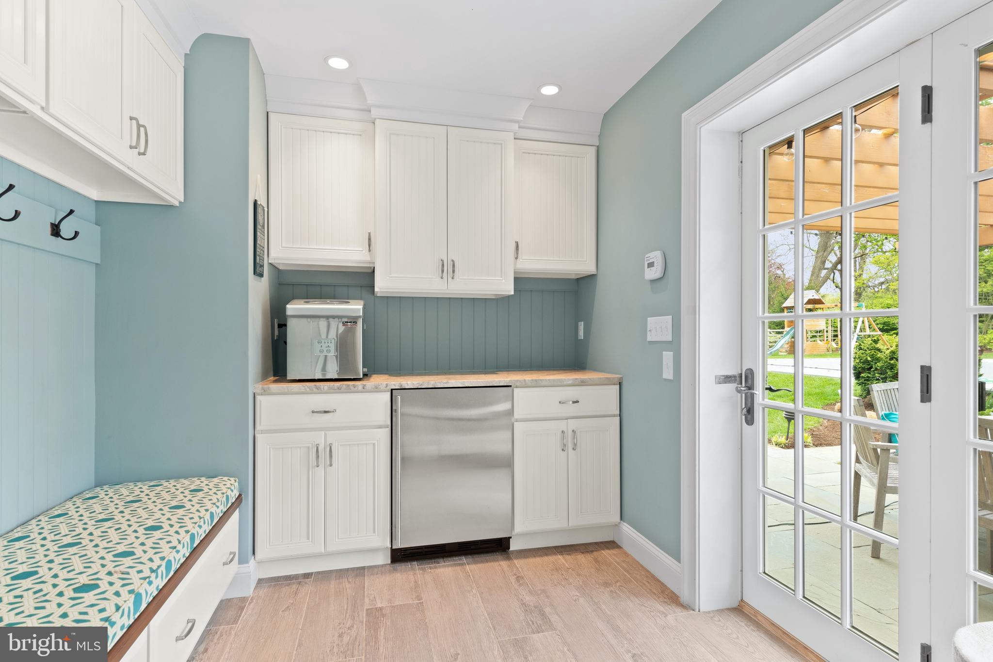 512 Dorset Road Devon, PA 19333 - Photo 46 of 48 a kitchen with kitchen island white cabinets and refrigerator