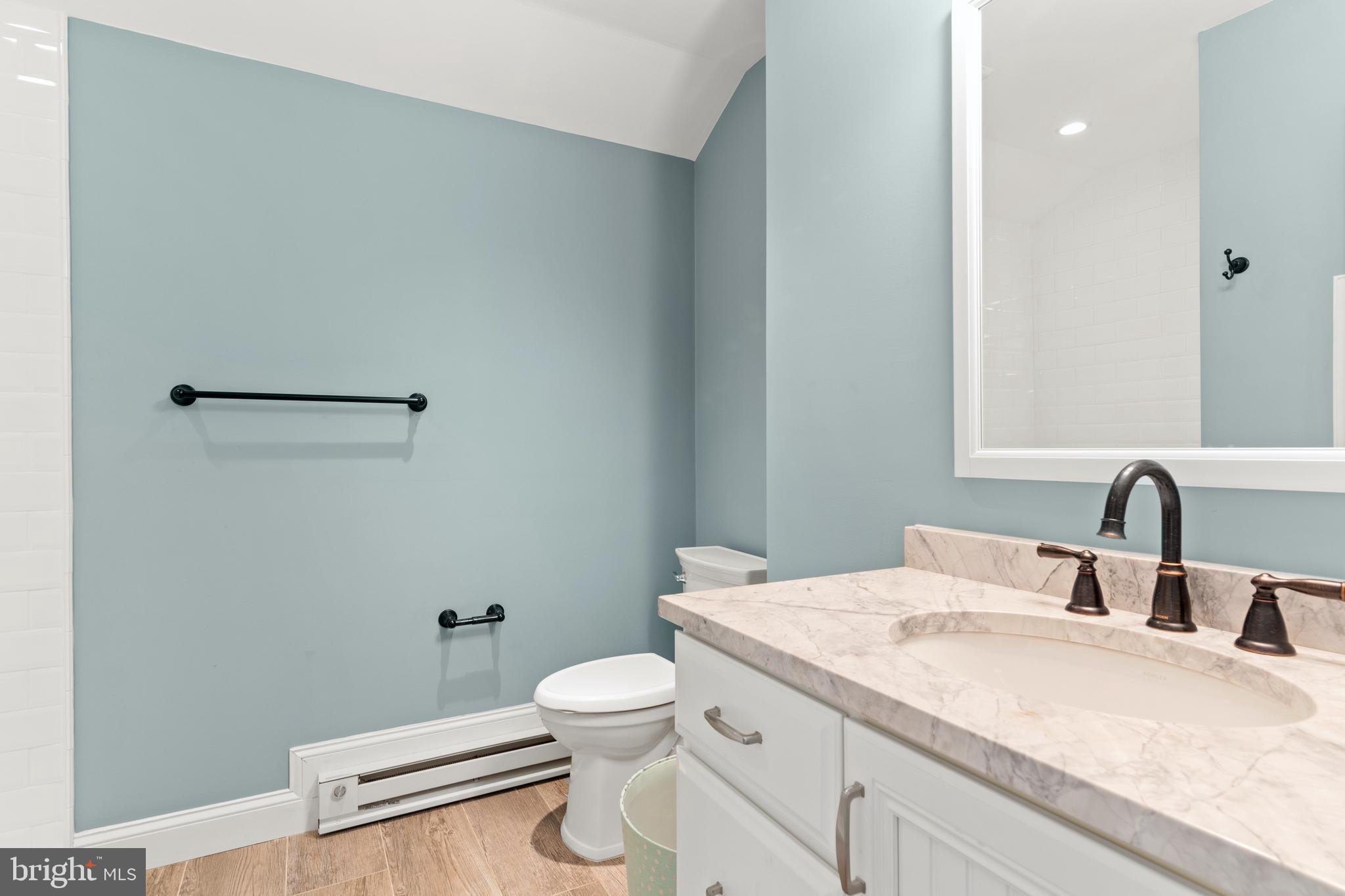 512 Dorset Road Devon, PA 19333 - Photo 48 of 48 a bathroom with a granite countertop sink vanity mirror and toilet