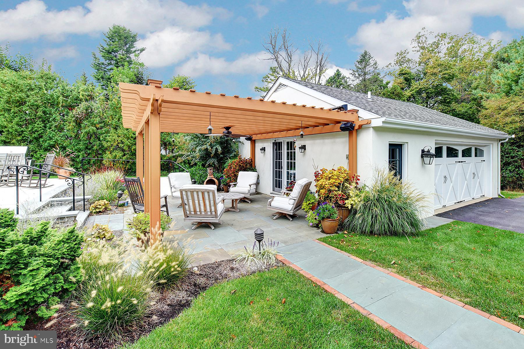 512 Dorset Road Devon, PA 19333 - Photo 7 of 48 a view of a chair and table in backyard of the house