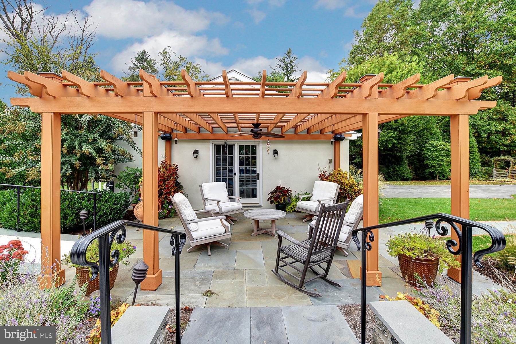 512 Dorset Road Devon, PA 19333 - Photo 8 of 48 a view of a patio with table and chairs potted plants with wooden floor and fence