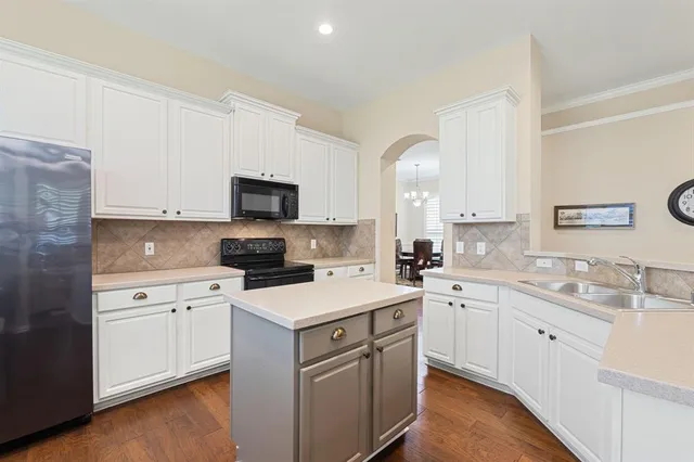 a kitchen with a sink and stove