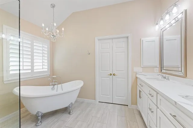 a bedroom with a bed and a lamp