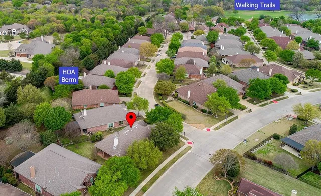 an aerial view of residential houses with outdoor space