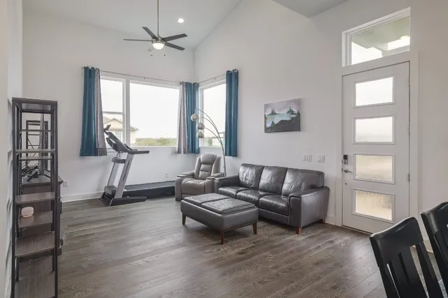 a living room with furniture and a large window