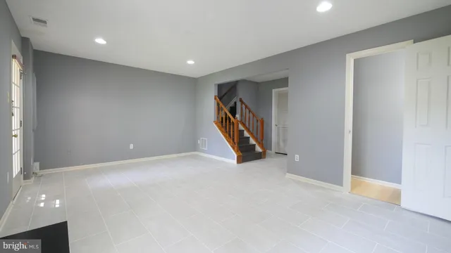 a bathroom with a tub a sink and mirror