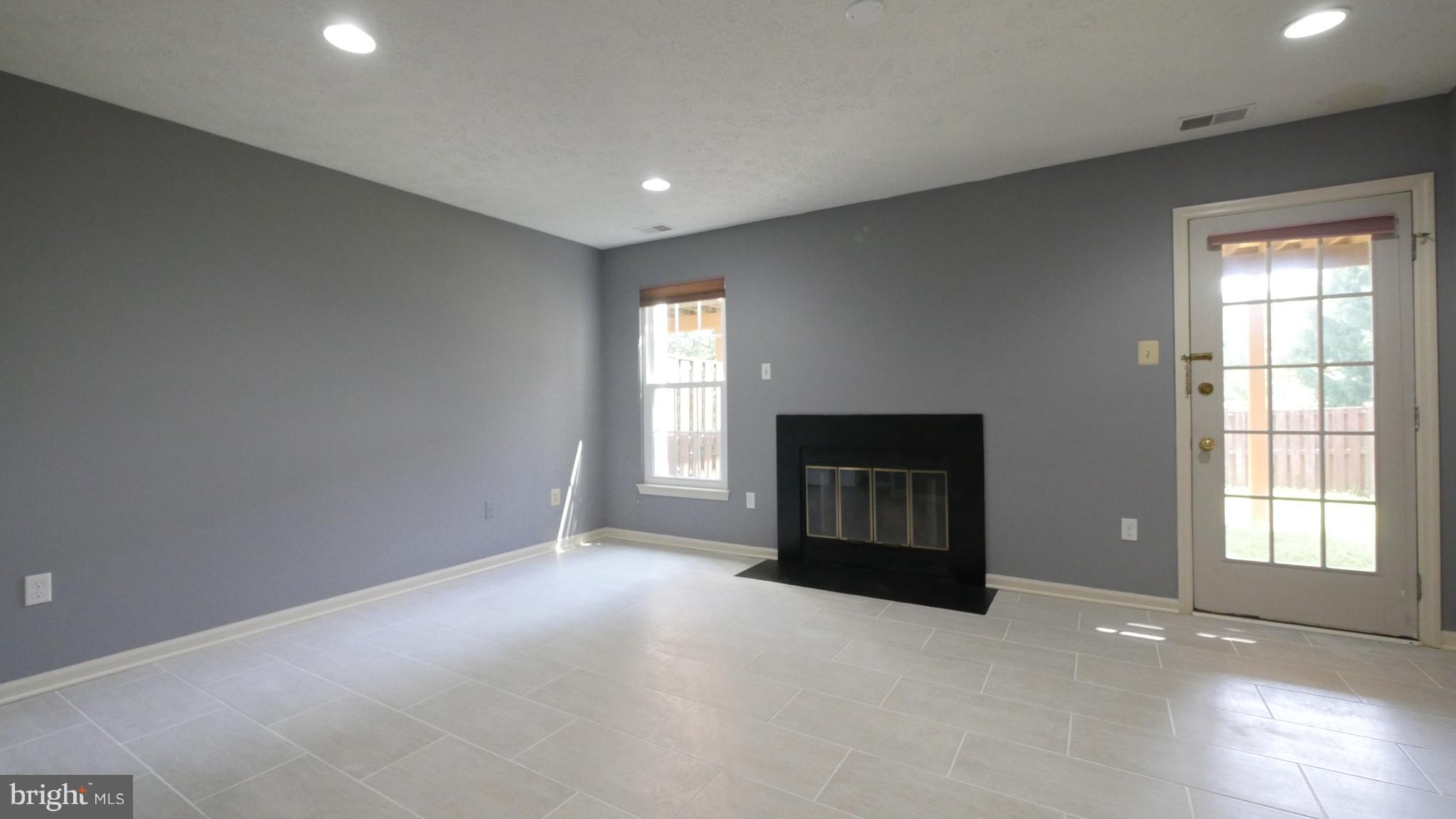 15 Beacon Hill Way Gaithersburg, MD 20878 - Photo 12 of 16 a view of an empty room with a window and bathroom