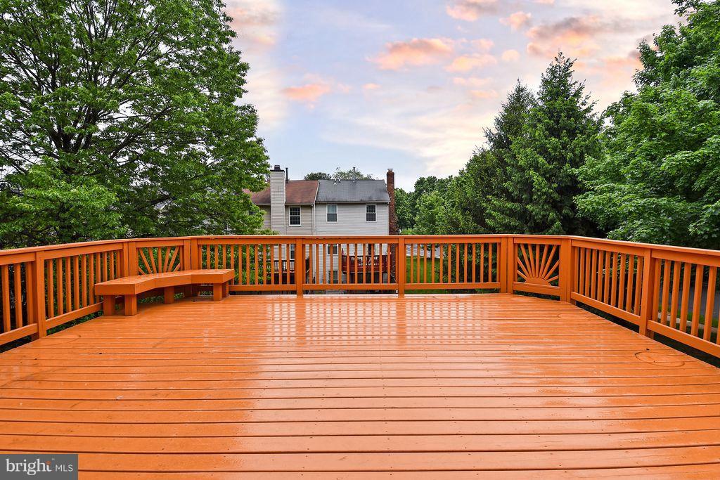 15 Beacon Hill Way Gaithersburg, MD 20878 - Photo 13 of 16 a view of a balcony with wooden floor and fence